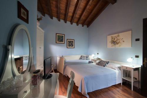 Postel nebo postele na pokoji v ubytování Hotel Al Castello
