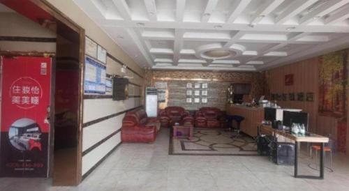 TV a/nebo společenská místnost v ubytování Jun Hotel Anhui Bozhou Lixin County Wenzhou Road