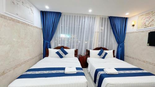 Ένα ή περισσότερα κρεβάτια σε δωμάτιο στο Victory Hotel 153-155