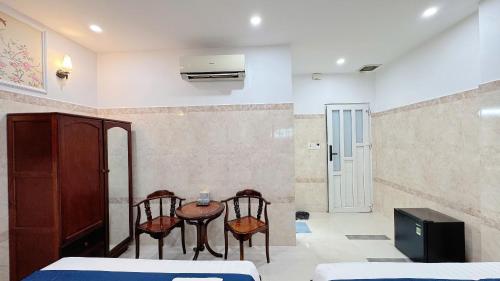 Ένα ή περισσότερα κρεβάτια σε δωμάτιο στο Victory Hotel 153-155