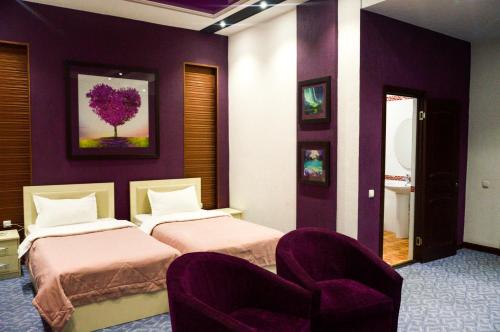 Letto o letti in una camera di Paradise Hotel