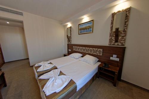 Postel nebo postele na pokoji v ubytování Hotel Aristokrat