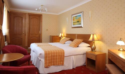 Postel nebo postele na pokoji v ubytování Leapark Hotel