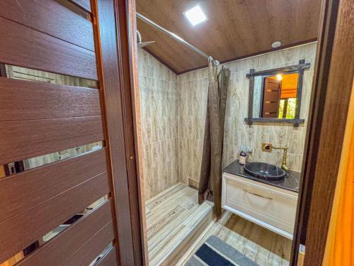 a small bathroom with a sink and a mirror at ErGarden in Byureghavan