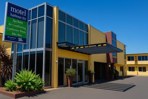 a hospital building with a sign in front of it at Harbour City Motor Inn & Conference in Tauranga