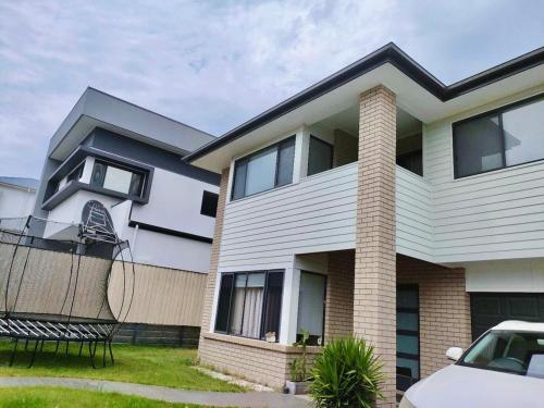 a house with a car parked in front of it at underwood MyHill in Kuraby