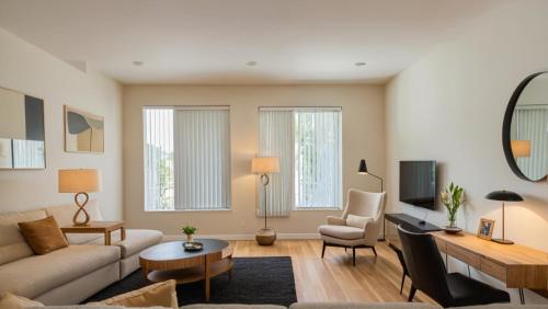 a living room with a couch and a table at Art District Downtown Spacious Homes in Los Angeles