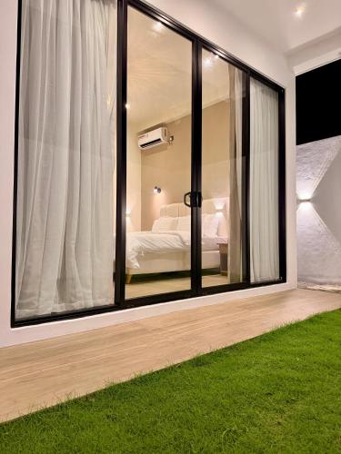 a bedroom with a window with a bed in it at La Vizta Weligama in Weligama