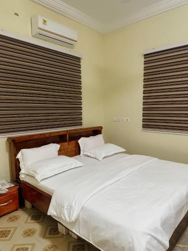 Ліжко або ліжка в номері Senalli Hotel