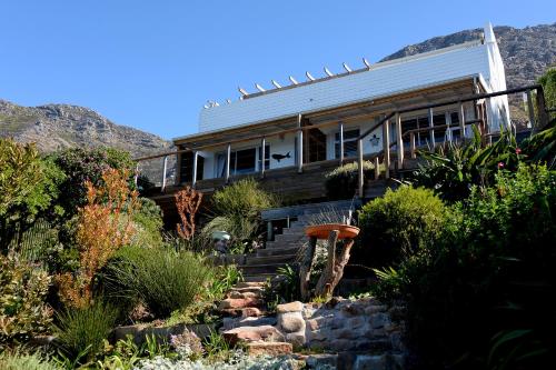 a house on the side of a mountain at Rocklands Seaside Bed and Breakfast in Simonʼs Town