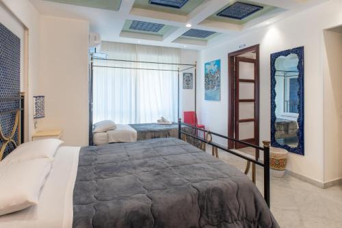 Postel nebo postele na pokoji v ubytování Federico 70 Arabic Style