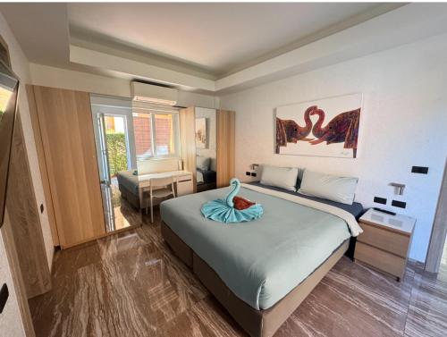 a bedroom with a bed with a fish on it at Juga Beach Front Villa 3B Koh Chang in Ko Chang