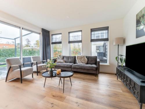 TV a/nebo společenská místnost v ubytování Pretty Holiday Home in De Koog Texel with Garden