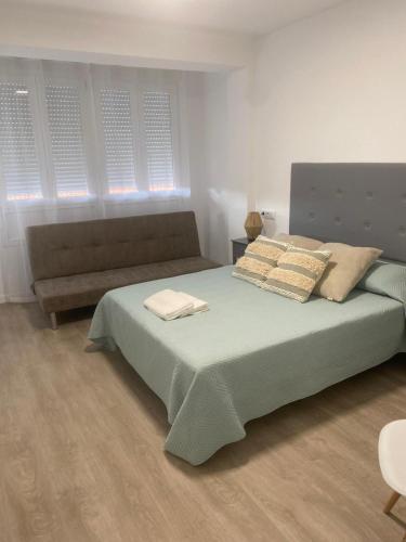 Postel nebo postele na pokoji v ubytování Pelayo Living