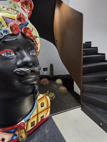 a statue of a woman wearing a headdress at B&B Il Moro Luxury Rooms in Syracuse