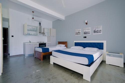 Postel nebo postele na pokoji v ubytování Blue Fox Hikkaduwa