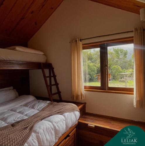 Postel nebo postele na pokoji v ubytování Hospedaria Leliak - Retiro Boutique de Montanha