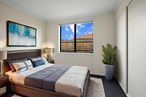 En eller flere senge i et værelse på East Luxury house