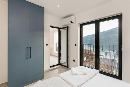 Postel nebo postele na pokoji v ubytování Apartments Villa Swissmonte 2