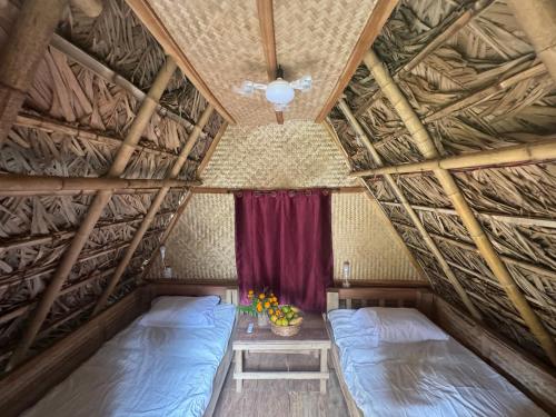 Postel nebo postele na pokoji v ubytování Petros Bungalows