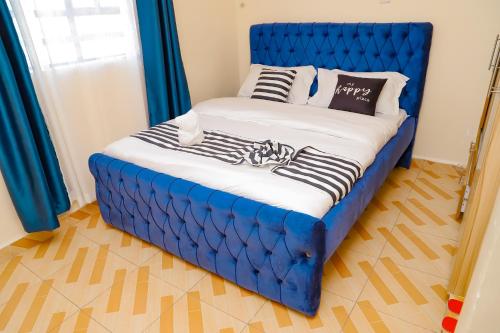 En eller flere senge i et værelse på Winnie Homes