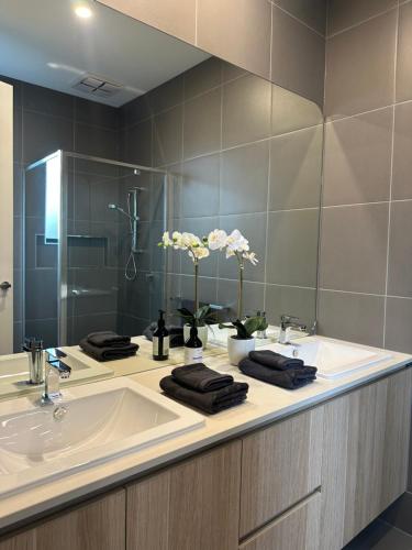 a bathroom with a sink and a large mirror at McCrae Retreat Brand New Home in McCrae
