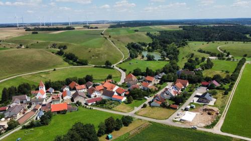 an aerial view of a small village with houses at Chalets Waldeck - Urlaub im Fränkischen Seenland und Altmühltal 