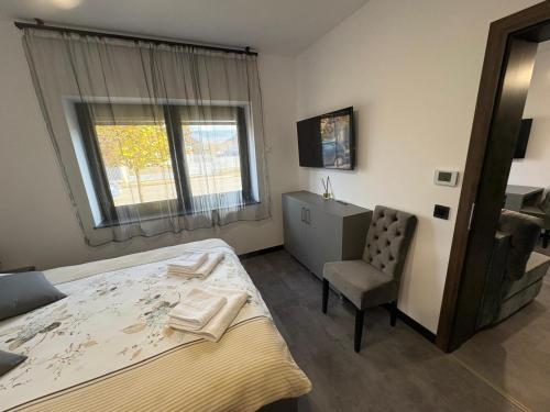 Ένα ή περισσότερα κρεβάτια σε δωμάτιο στο Râului 43