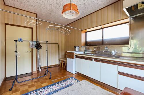 a kitchen with a sink and a window at Sagamihara - House - Vacation STAY 15450 in Toya