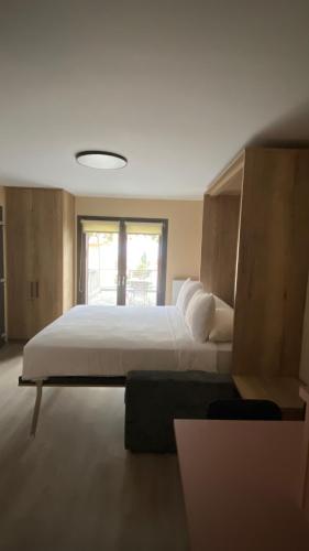 Postel nebo postele na pokoji v ubytování Manoria studio