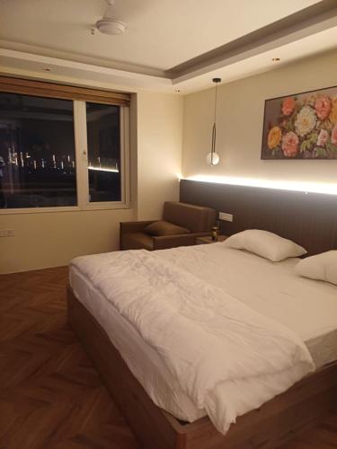 Ένα ή περισσότερα κρεβάτια σε δωμάτιο στο Studio apartment in Suntwilight near to expomart