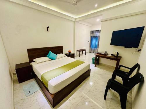 Postel nebo postele na pokoji v ubytování Emerald Home Stay