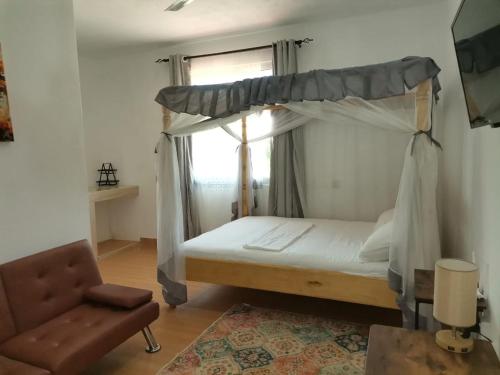 Ένα ή περισσότερα κρεβάτια σε δωμάτιο στο Seacrest Apartments