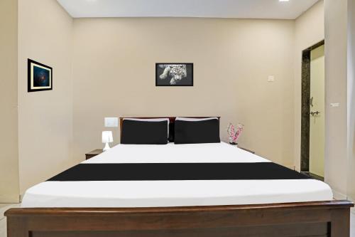 Ένα ή περισσότερα κρεβάτια σε δωμάτιο στο Hotel O Mint Leaf & Lodging