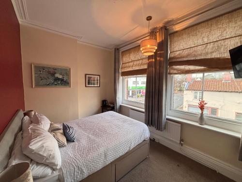 Ένα ή περισσότερα κρεβάτια σε δωμάτιο στο Tramway Hotel