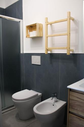 a bathroom with a toilet and a sink at B&B Dai Nonni in Mongiove