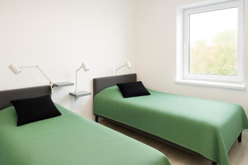 Ένα ή περισσότερα κρεβάτια σε δωμάτιο στο Apartament na Zakręcie