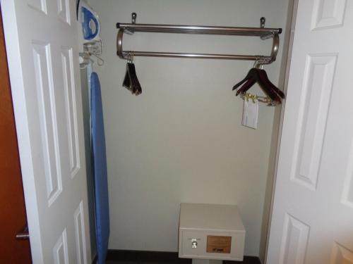 a closet with a towel rack and a door at Wingate by Wyndham Destin in Destin