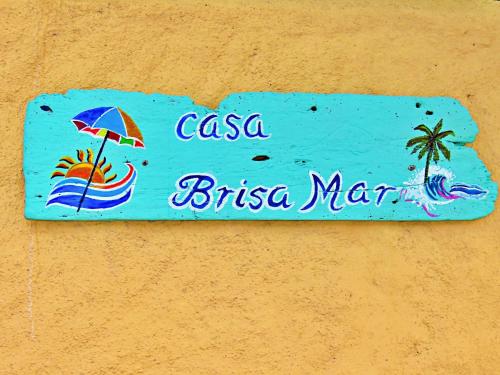 a sign that says casa brasiliama on a wall at Casa Brisamar , Studios in Puerto Morelos
