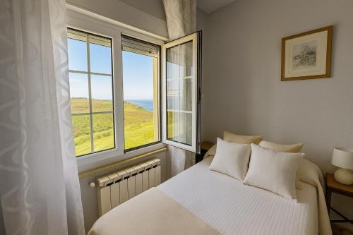 Postel nebo postele na pokoji v ubytování Apartamentos casa Carola