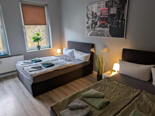 a bedroom with two beds and a window at Flensburg Strandnah in Flensburg
