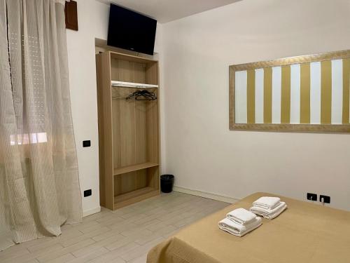 Ένα ή περισσότερα κρεβάτια σε δωμάτιο στο Domus Pellicciai