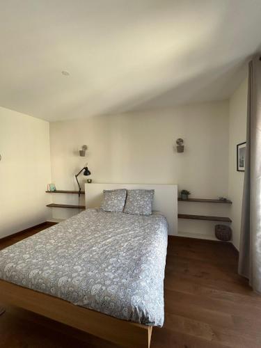 Postel nebo postele na pokoji v ubytování L'Escapade Narbonnaise