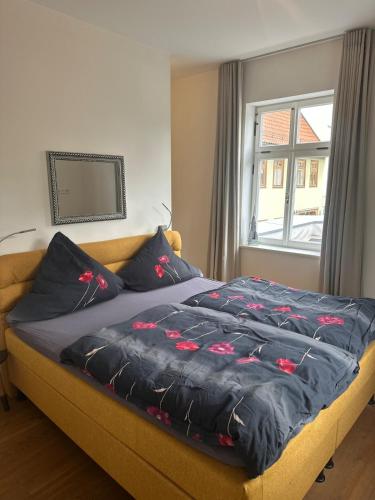 En eller flere senge i et værelse på Exklusive Unterkunft im Herzen der Altstadt