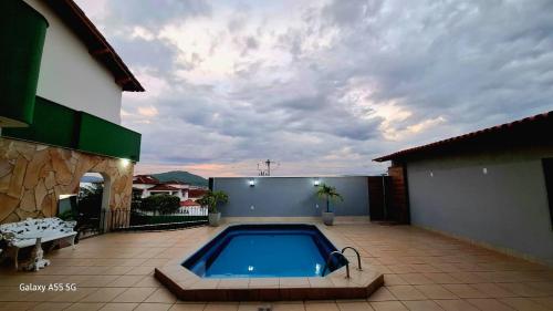 a swimming pool on the patio of a house at Hotel Master in Salinas