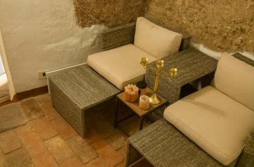 a room with two chairs and a table at The secret room in Pitigliano