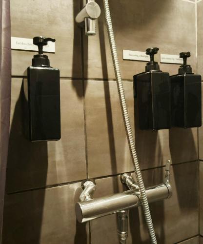 a group of lights on a wall in a bathroom at Studio centre historique 200 m de la mairie - Climatisé in Aix-en-Provence