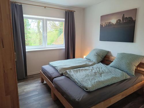 En eller flere senge i et værelse på Ferienwohnungen auf Hof Elseblick