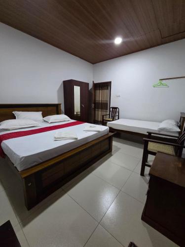 Ένα ή περισσότερα κρεβάτια σε δωμάτιο στο Sky Bloom Homagama