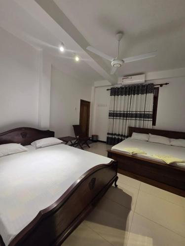 Ένα ή περισσότερα κρεβάτια σε δωμάτιο στο Sky Bloom Homagama